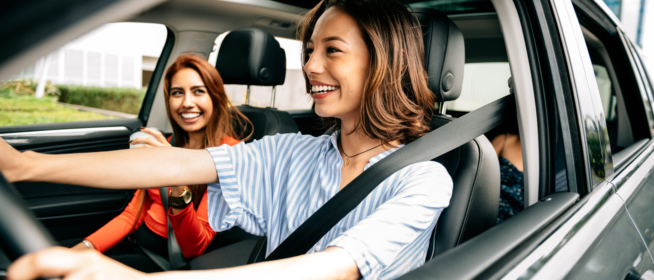 women in a car together